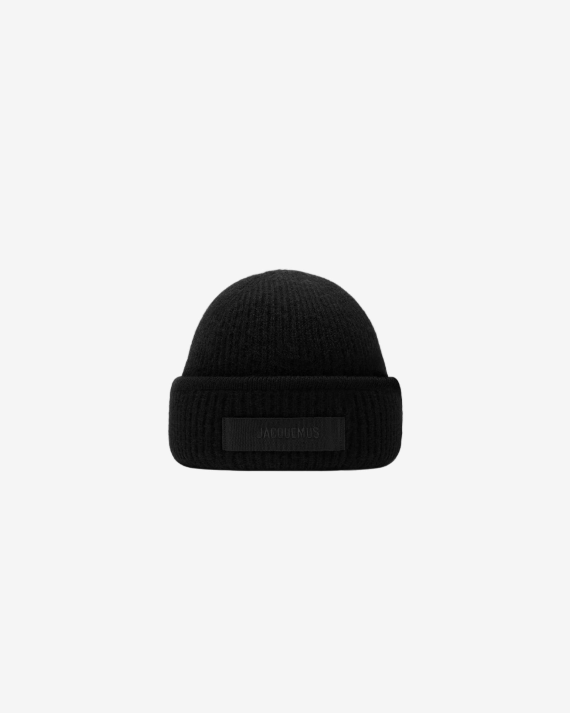 Black beanie hat on a white background