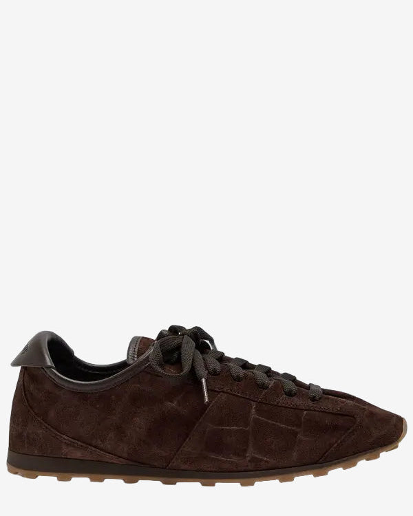 Brown suede sneaker on a white background