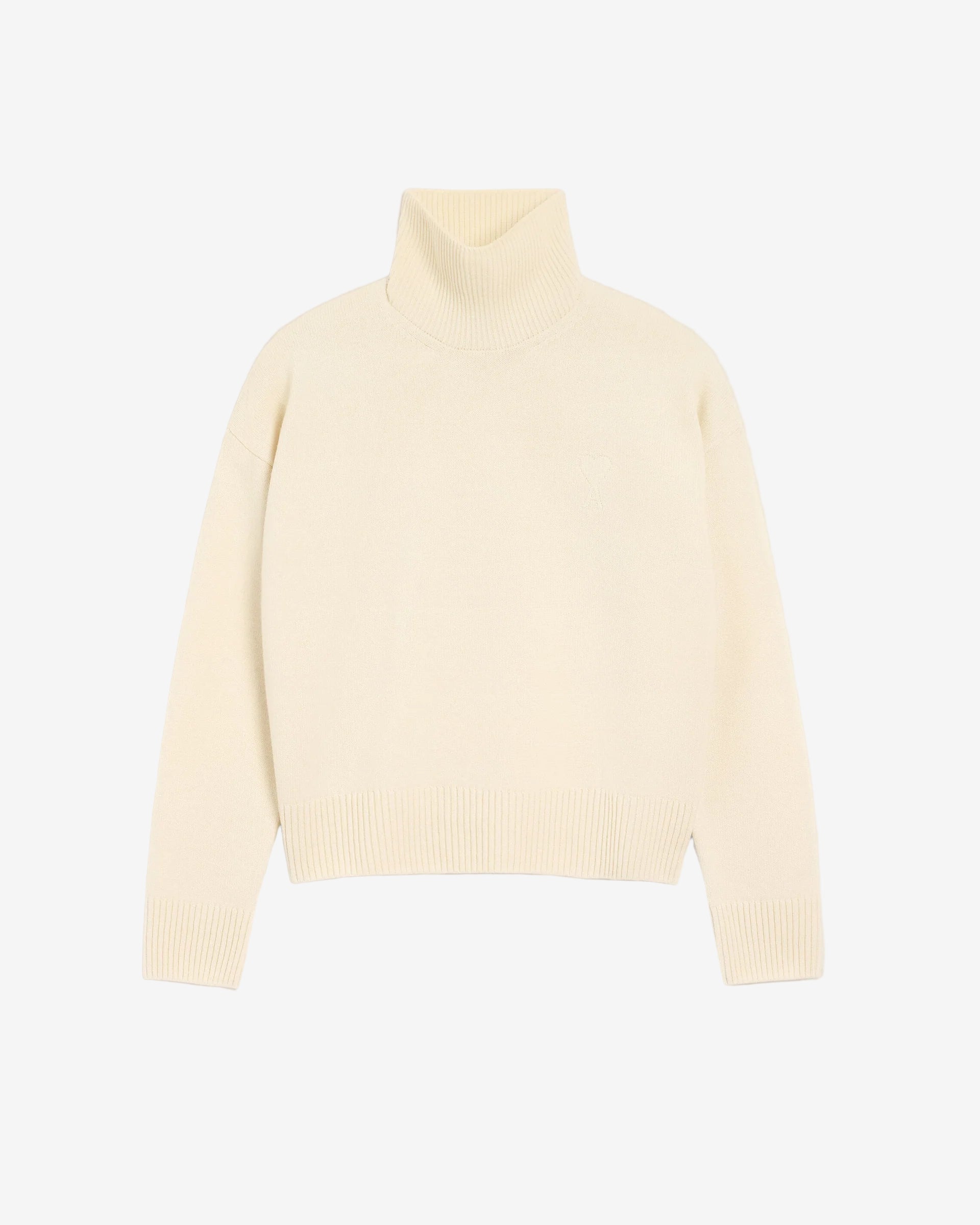 Cream-colored turtleneck sweater on a light gray background