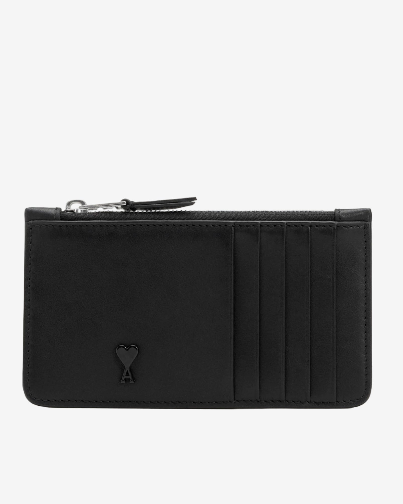 Black leather wallet with a heart emblem on a light beige background