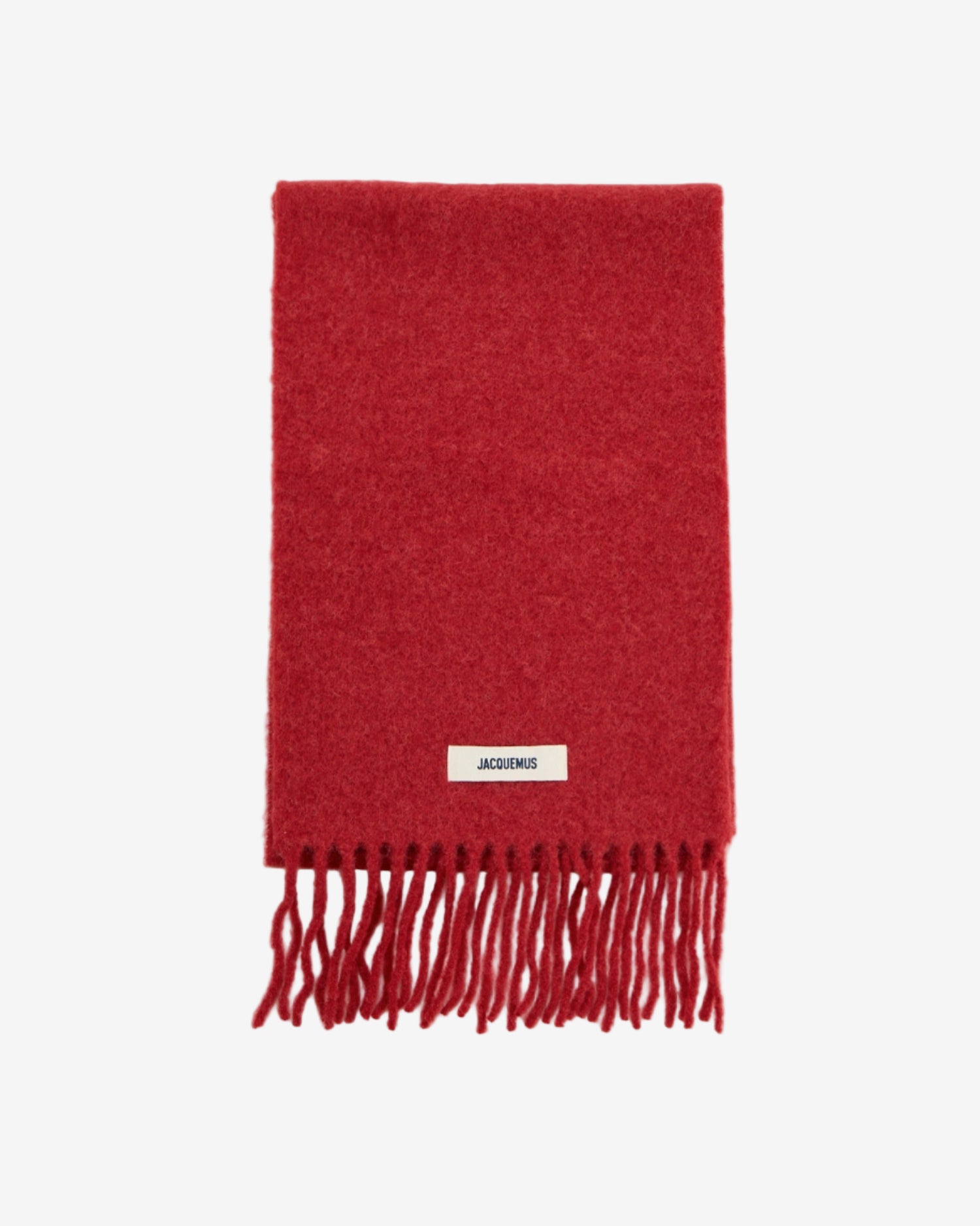 Red scarf with fringes and a brand label on a white background