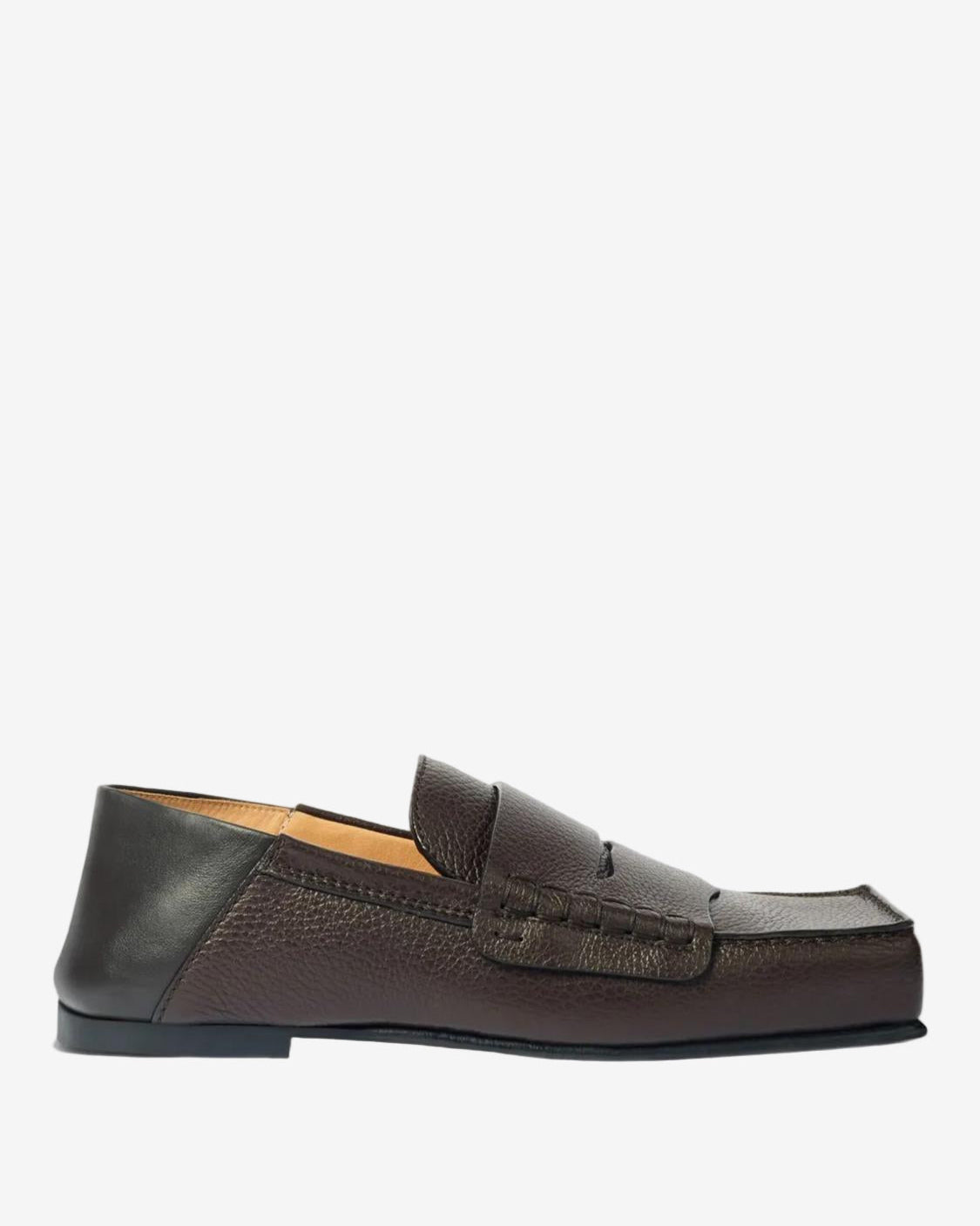 Brown loafer shoe on a light gray background