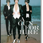 Book cover of 'A Gun for Hire' by Helmut Newton featuring three women in stylish outfits.