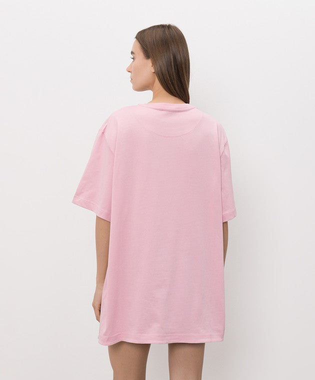 A light pink short-sleeve t-shirt with a small tonal pink ATTICO' logo on the left chest, displayed on a neutral light gray background.