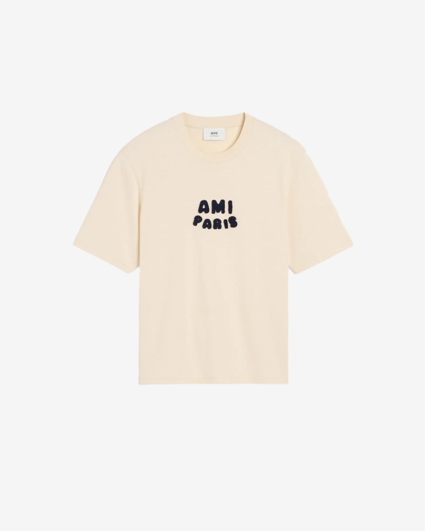 Beige t-shirt with 'AM! PARIS' text on a light gray background