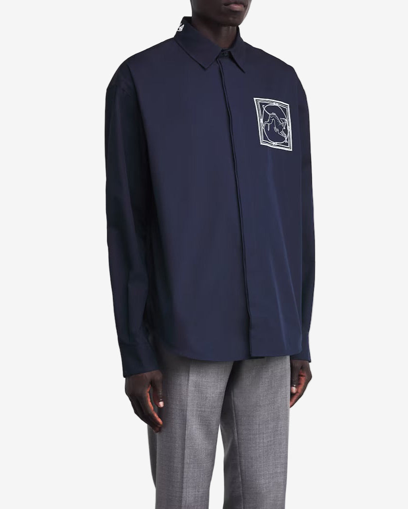 Navy blue shirt with a small graphic on the chest against a white background