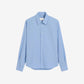 Light blue shirt on a beige background