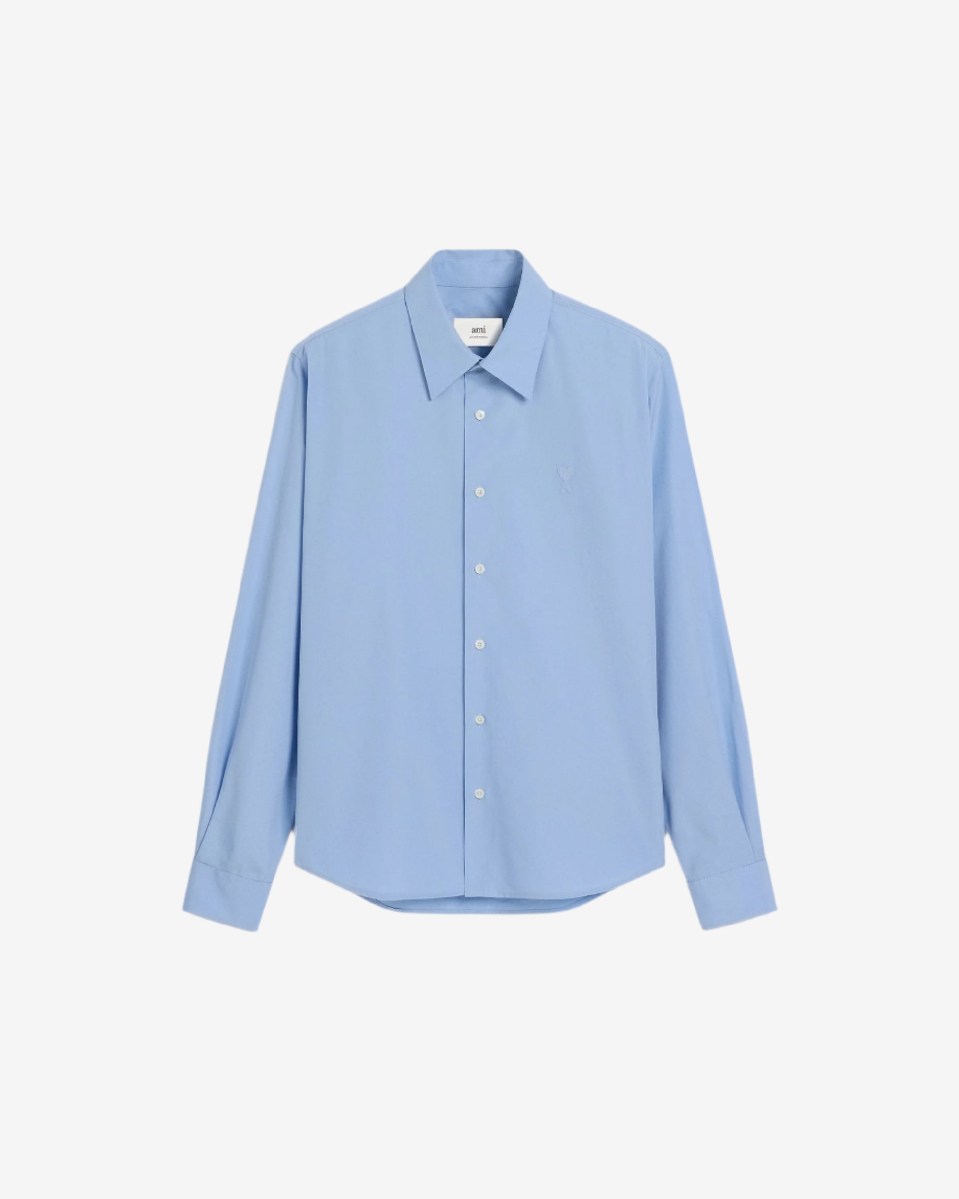 Light blue shirt on a beige background