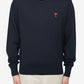Navy blue sweater with a red heart and letter 'A' logo on a white background