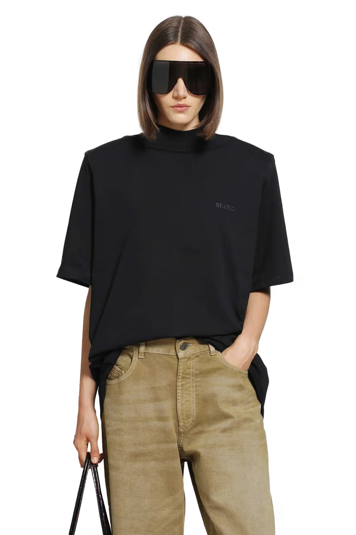 A black short-sleeve t-shirt with a mock neck collar and a small white 'ATTICO' logo on the left chest, displayed against a solid white background.
