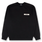 Black sweatshirt with a small white logo on a white background