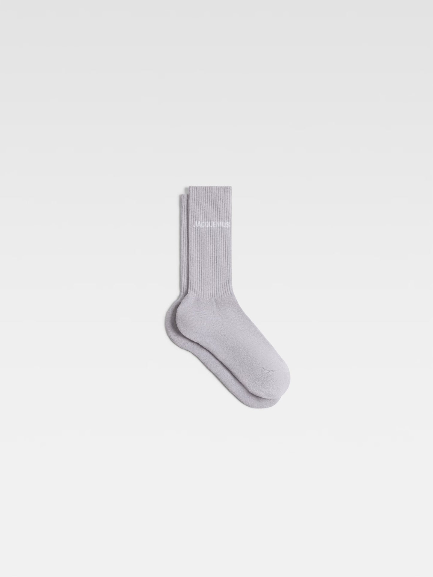 Gray sock with brand logo on a white background