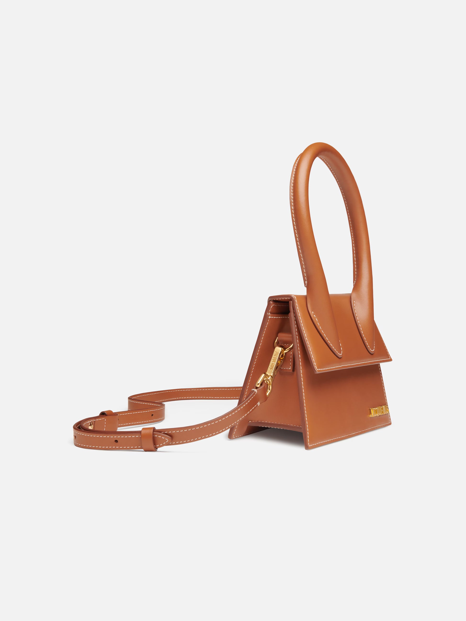 Brown handbag with a gold clasp on a white background