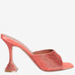 Coral high-heeled shoe with rhinestone embellishments on a white background