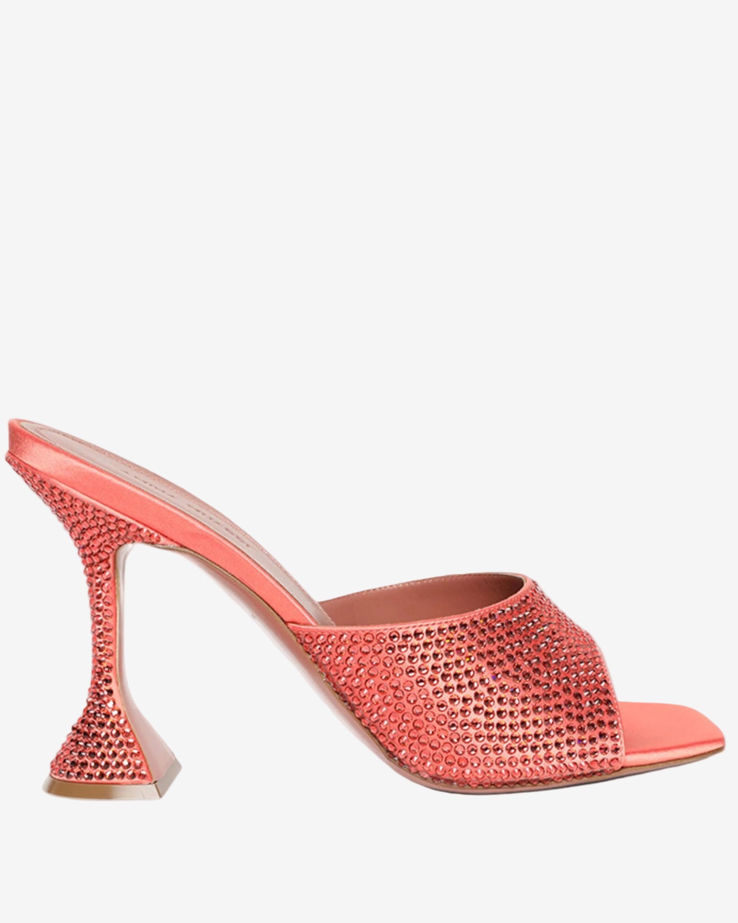 Coral high-heeled shoe with rhinestone embellishments on a white background