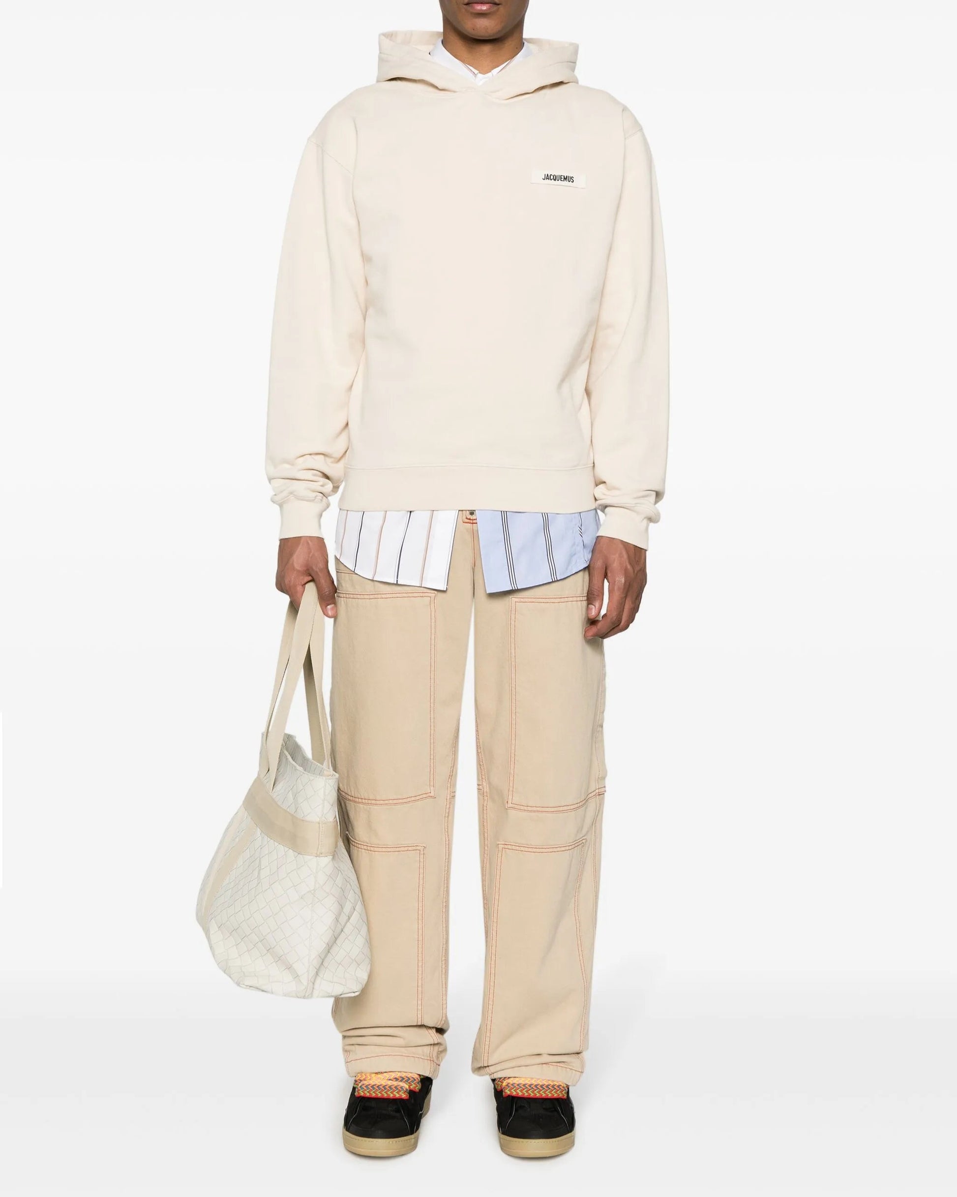 Beige hoodie with a brand logo on a white background