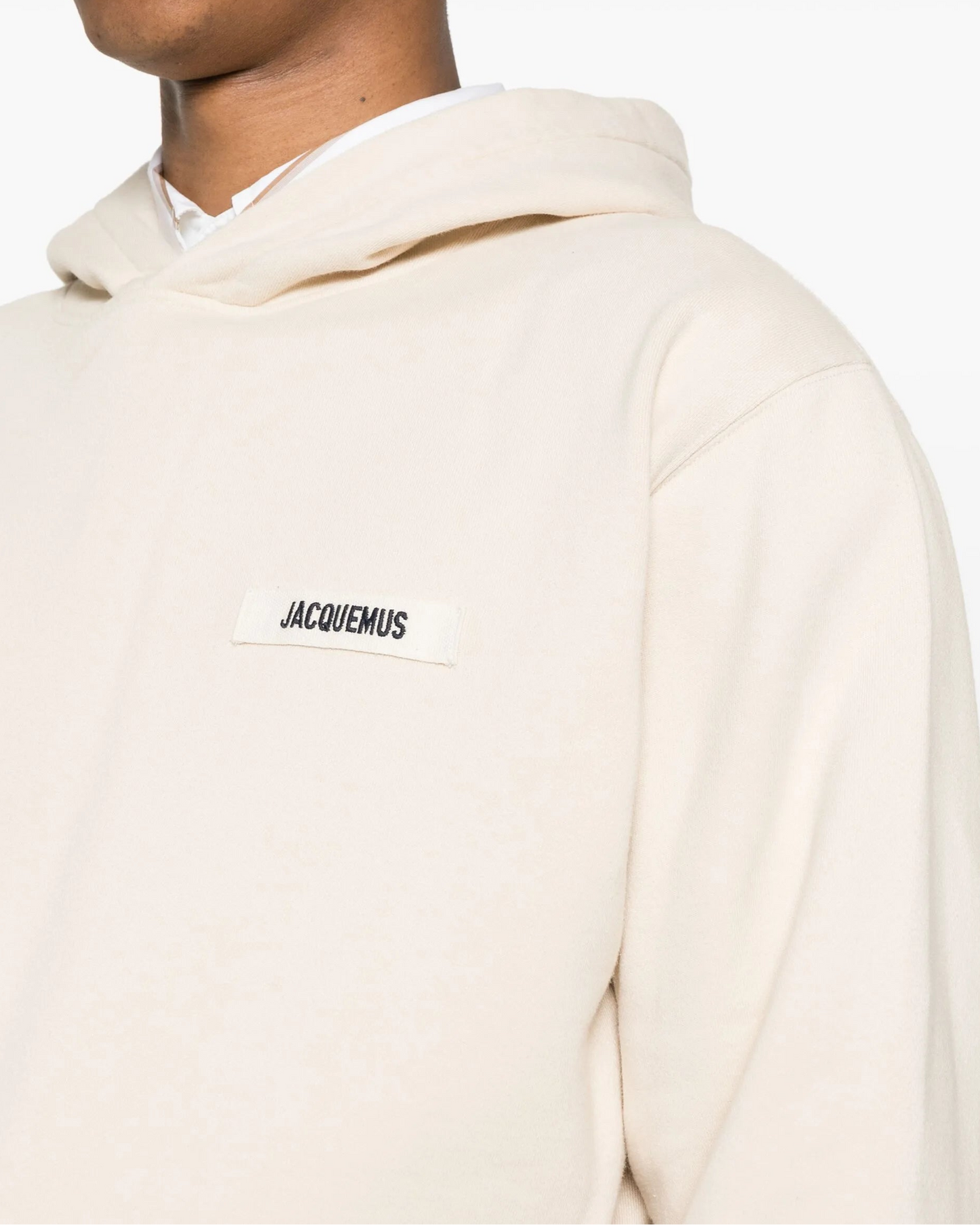 Beige hoodie with a brand logo on a white background
