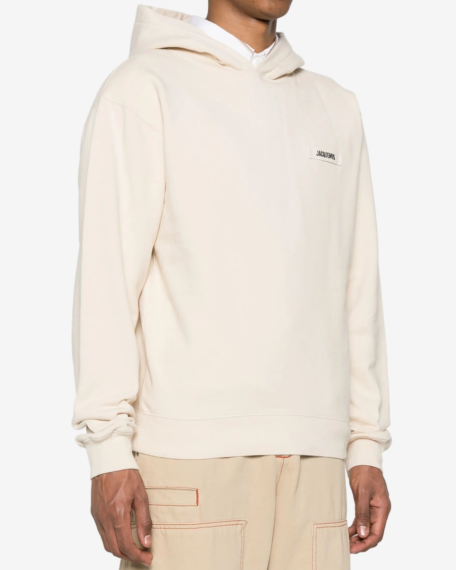 Beige hoodie with a brand logo on a white background