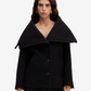 Black coat worn by a model on a white background