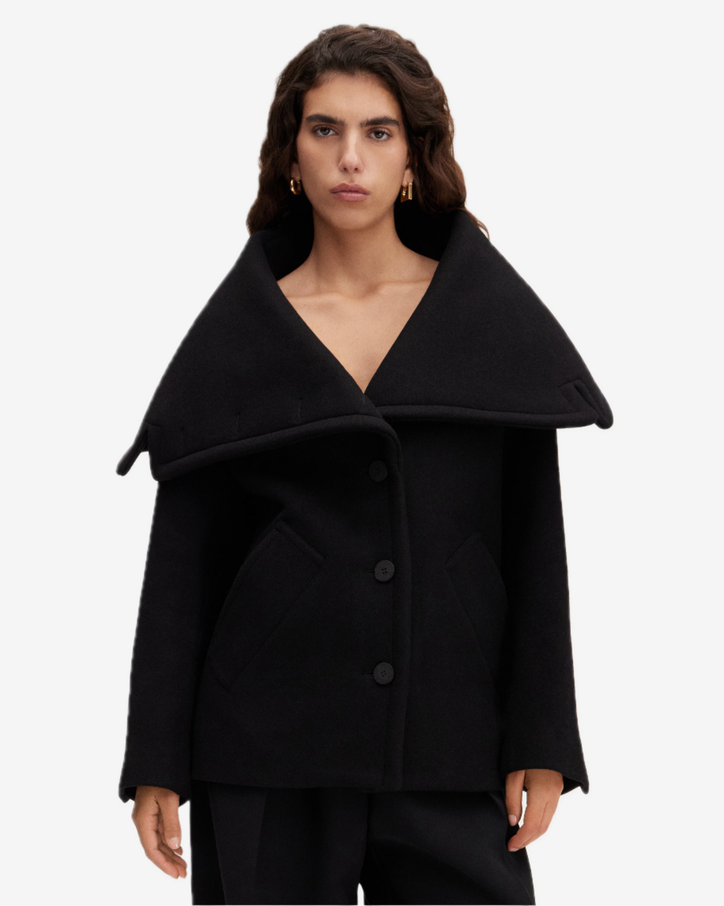 Black coat worn by a model on a white background