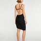 Black dress with thin straps and a draped design on a white background