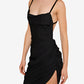 Black dress with thin straps and a draped design on a white background