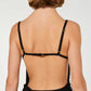 Black dress with thin straps and a draped design on a white background