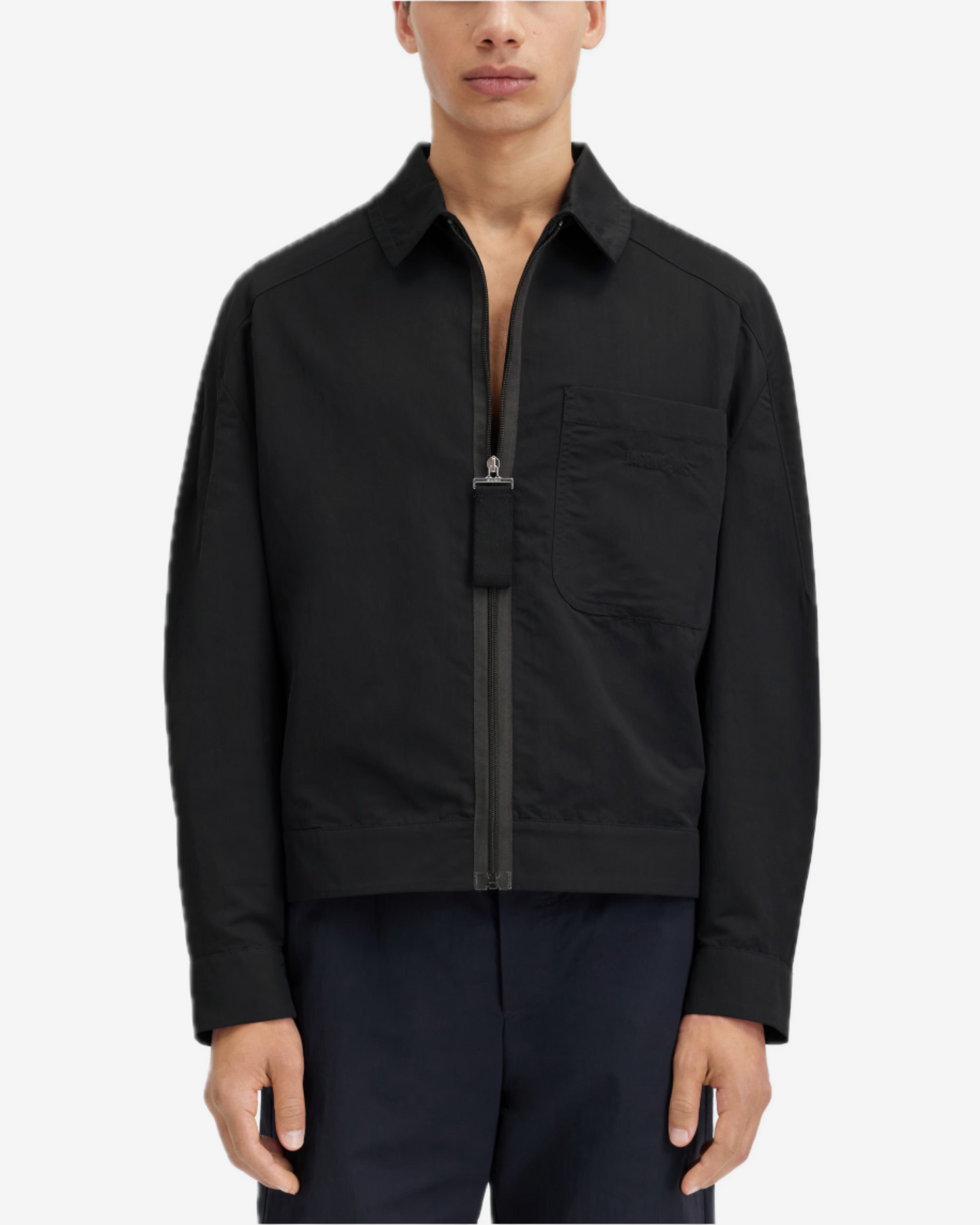 Person wearing a black jacket on a white background