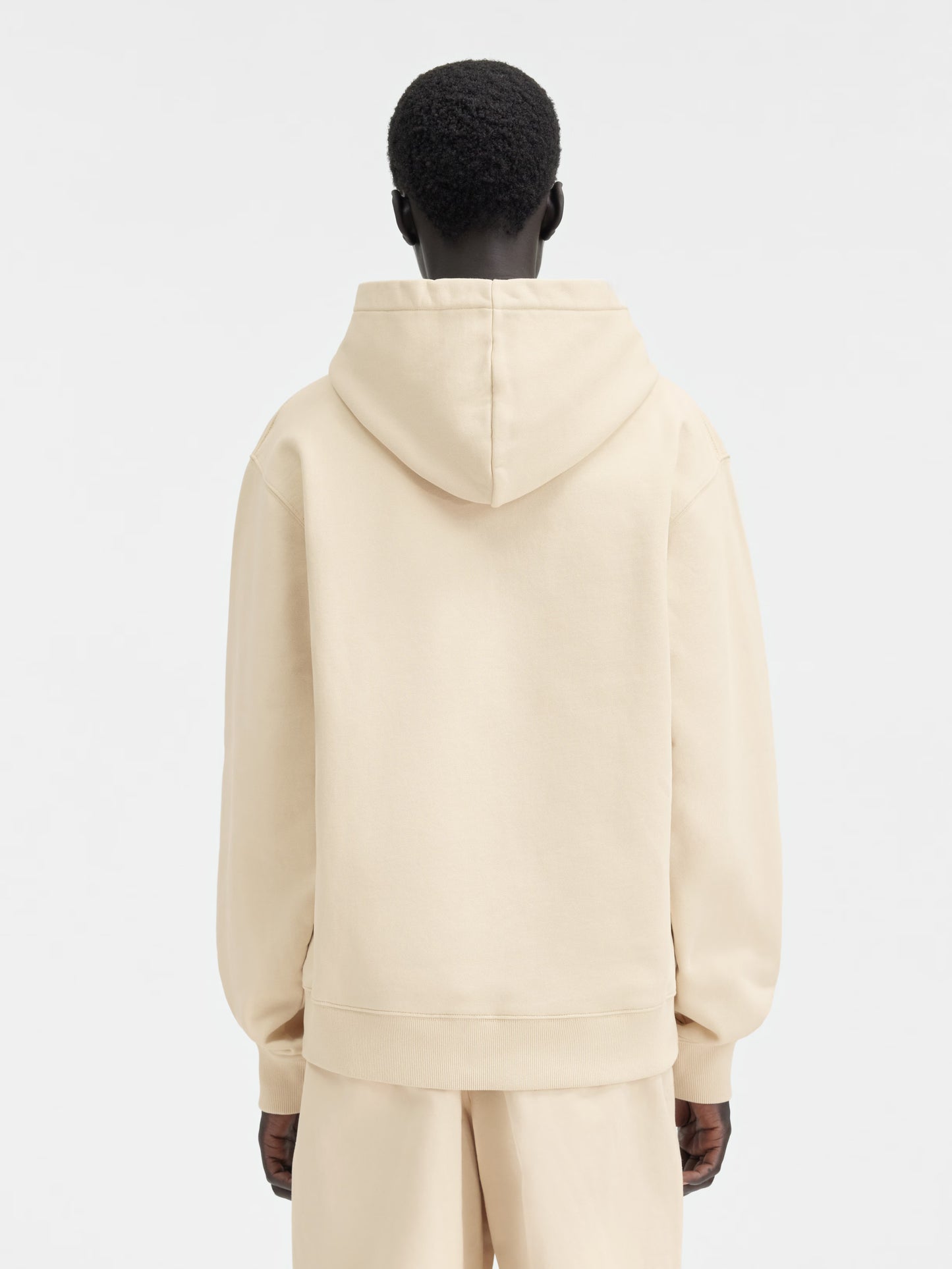 Beige hoodie on a light gray background