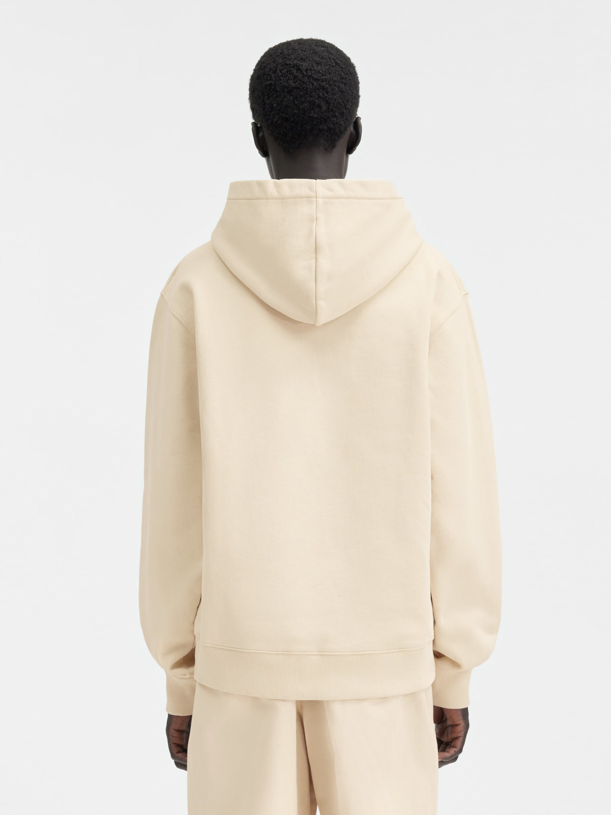 Beige hoodie on a light gray background
