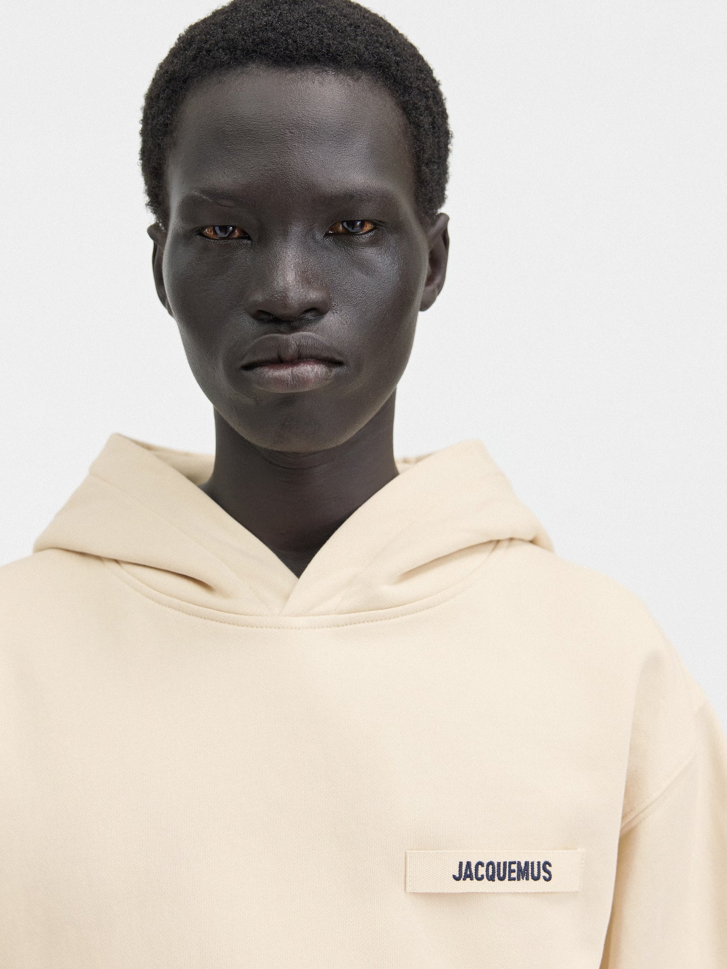 Beige hoodie on a light gray background