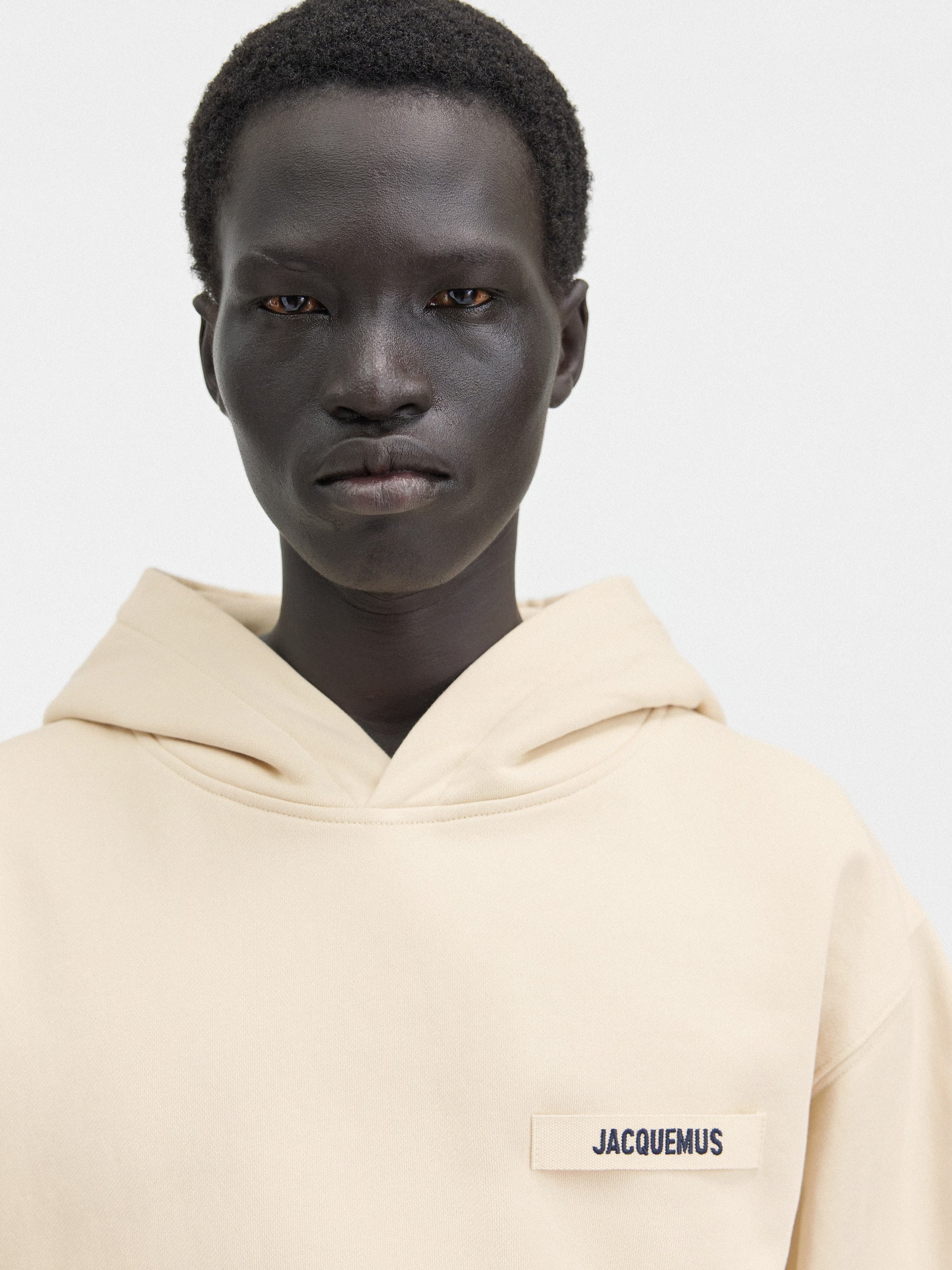 Beige hoodie on a light gray background