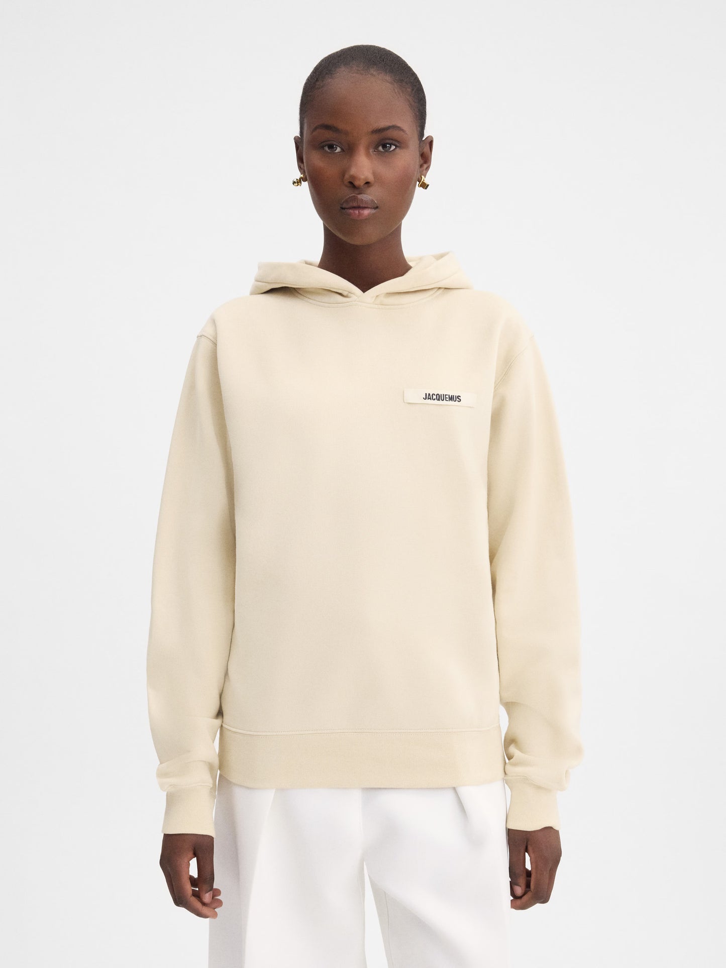 Beige hoodie on a light gray background