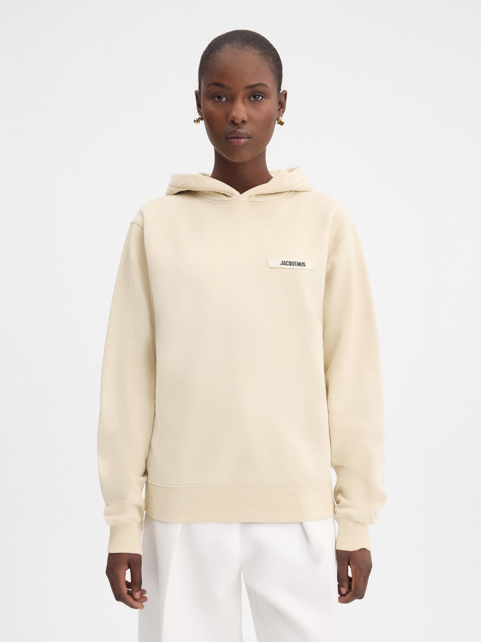 Beige hoodie on a light gray background