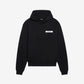 Person wearing a black hoodie with a brand logo on a white background