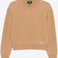 Beige sweater with 'A.P.C.' branding on a white background