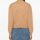Beige sweater with 'A.P.C.' branding on a white background