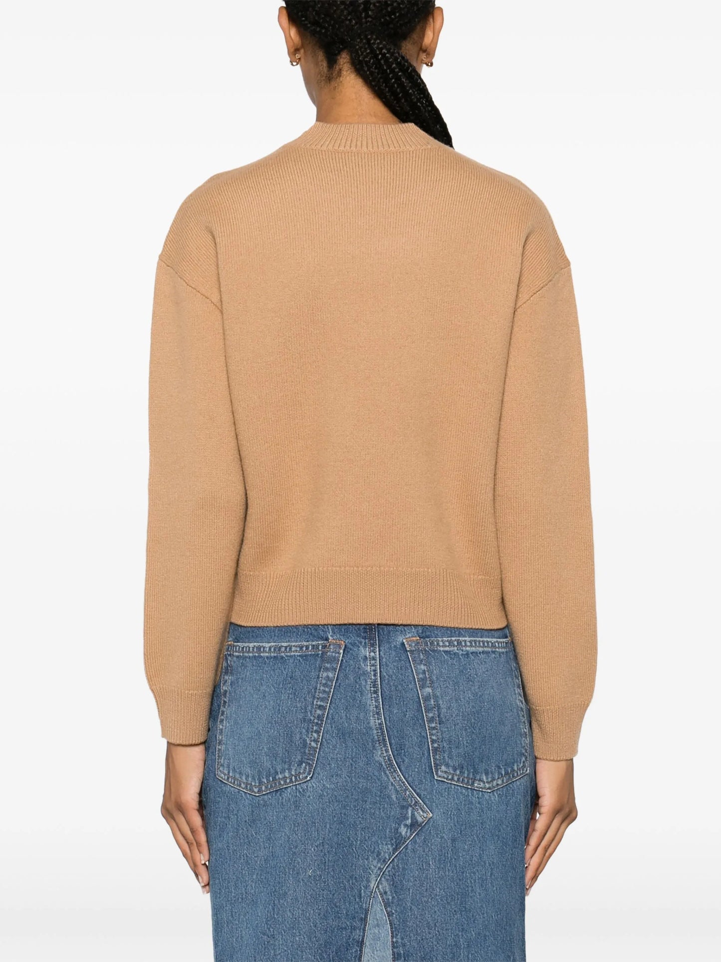 Beige sweater with 'A.P.C.' branding on a white background