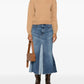 Beige sweater with 'A.P.C.' branding on a white background