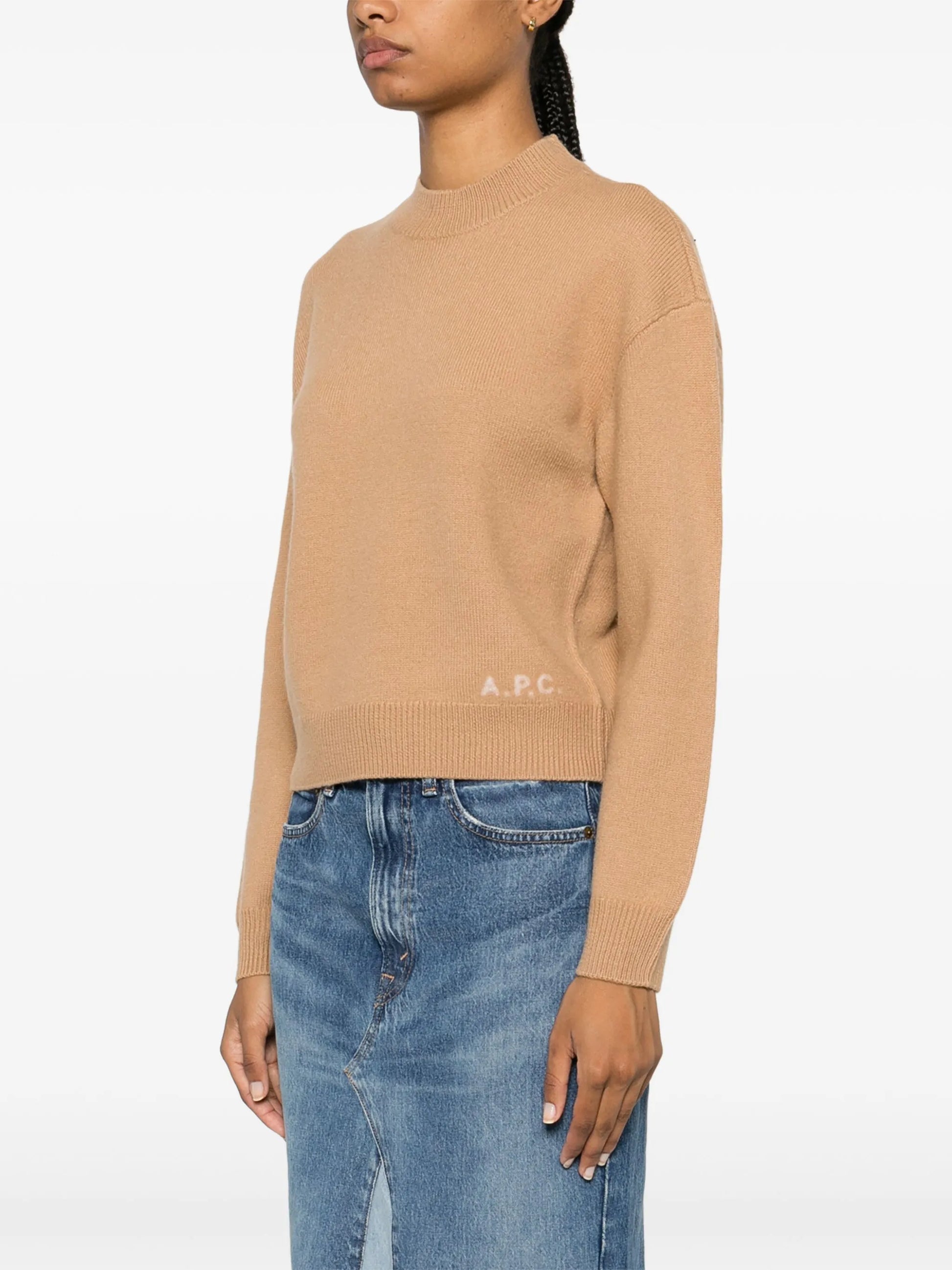Beige sweater with 'A.P.C.' branding on a white background