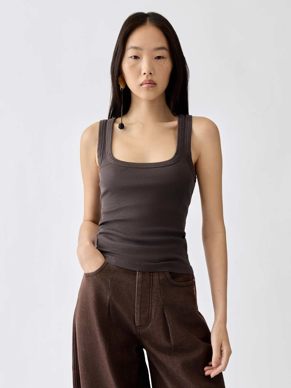 brown Crafted from soft ribbed cotton jersey, this fitted tank top is defined by a second skin silhouette and a minimalist design, finished with the signature grosgrain logo detail at the back.

100% ribbed cotton jersey construction

Fitted, second skin silhouette

Square neckline

Ribbed neckline and armholes

Embroidered grosgrain logo at the back