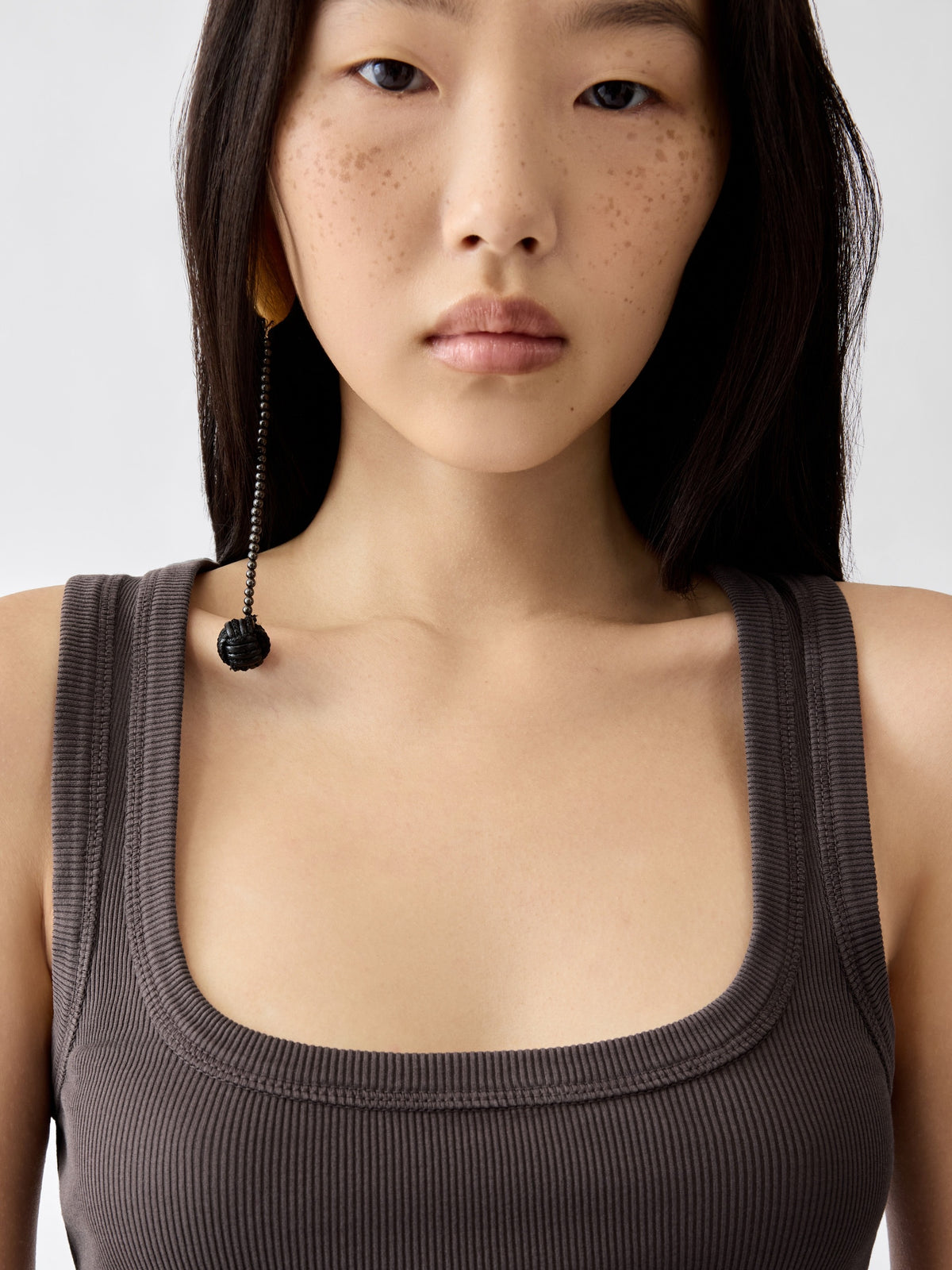 brown Crafted from soft ribbed cotton jersey, this fitted tank top is defined by a second skin silhouette and a minimalist design, finished with the signature grosgrain logo detail at the back.

100% ribbed cotton jersey construction

Fitted, second skin silhouette

Square neckline

Ribbed neckline and armholes

Embroidered grosgrain logo at the back