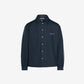 Dark blue shirt with a brand logo on a light gray background
