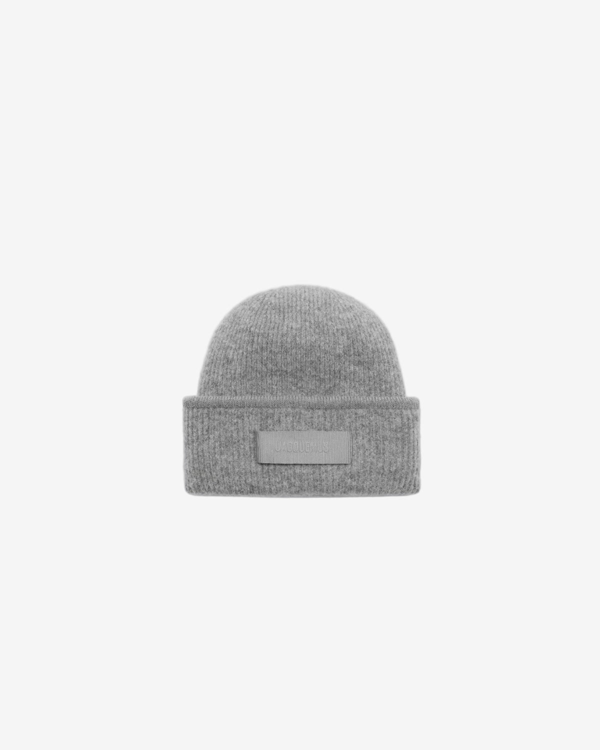Gray knit beanie with a patch on a white background