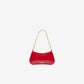 Red handbag with gold chain strap on a white background