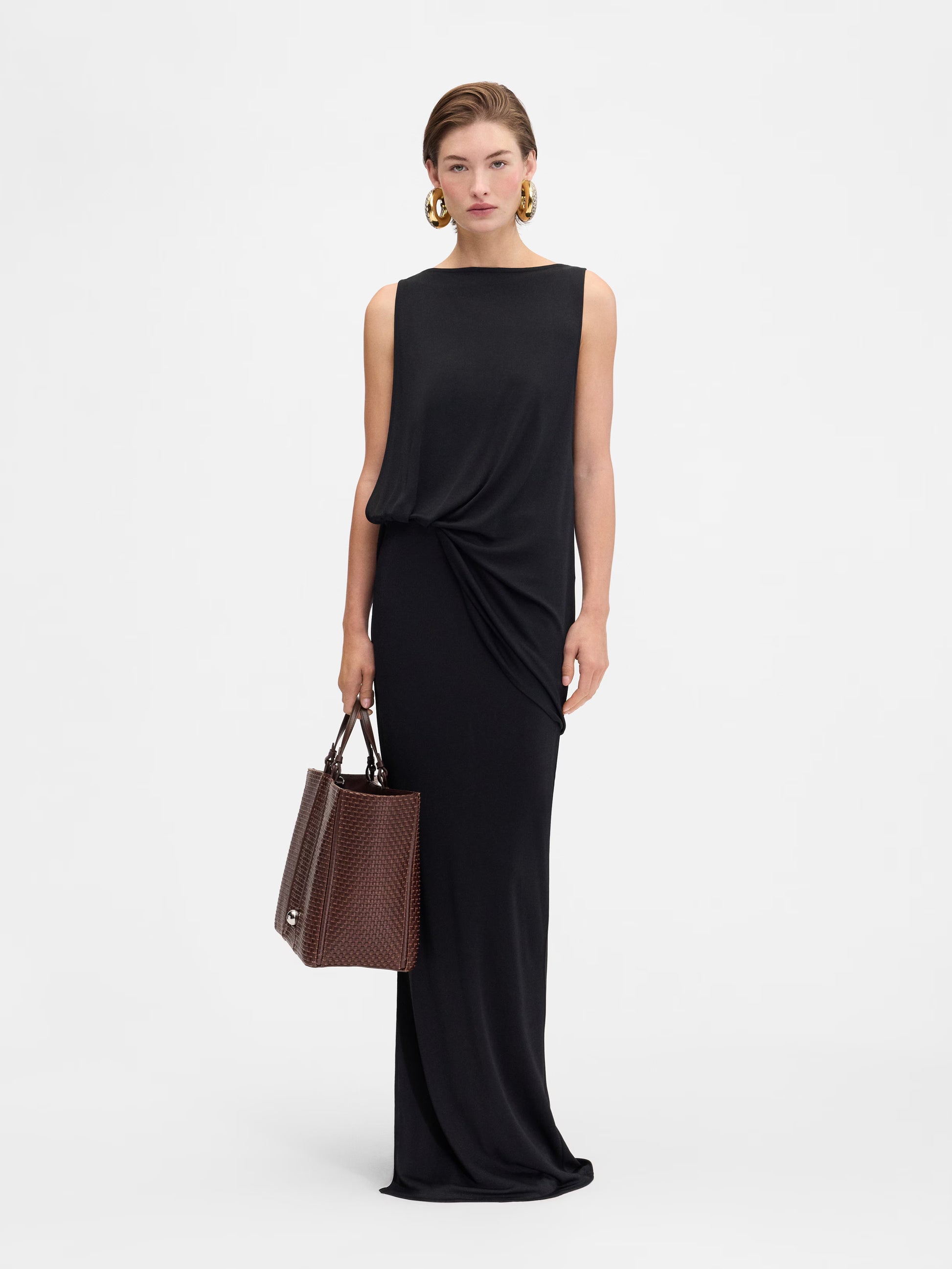 Black strapless gown on a white background