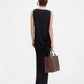 Black strapless gown on a white background
