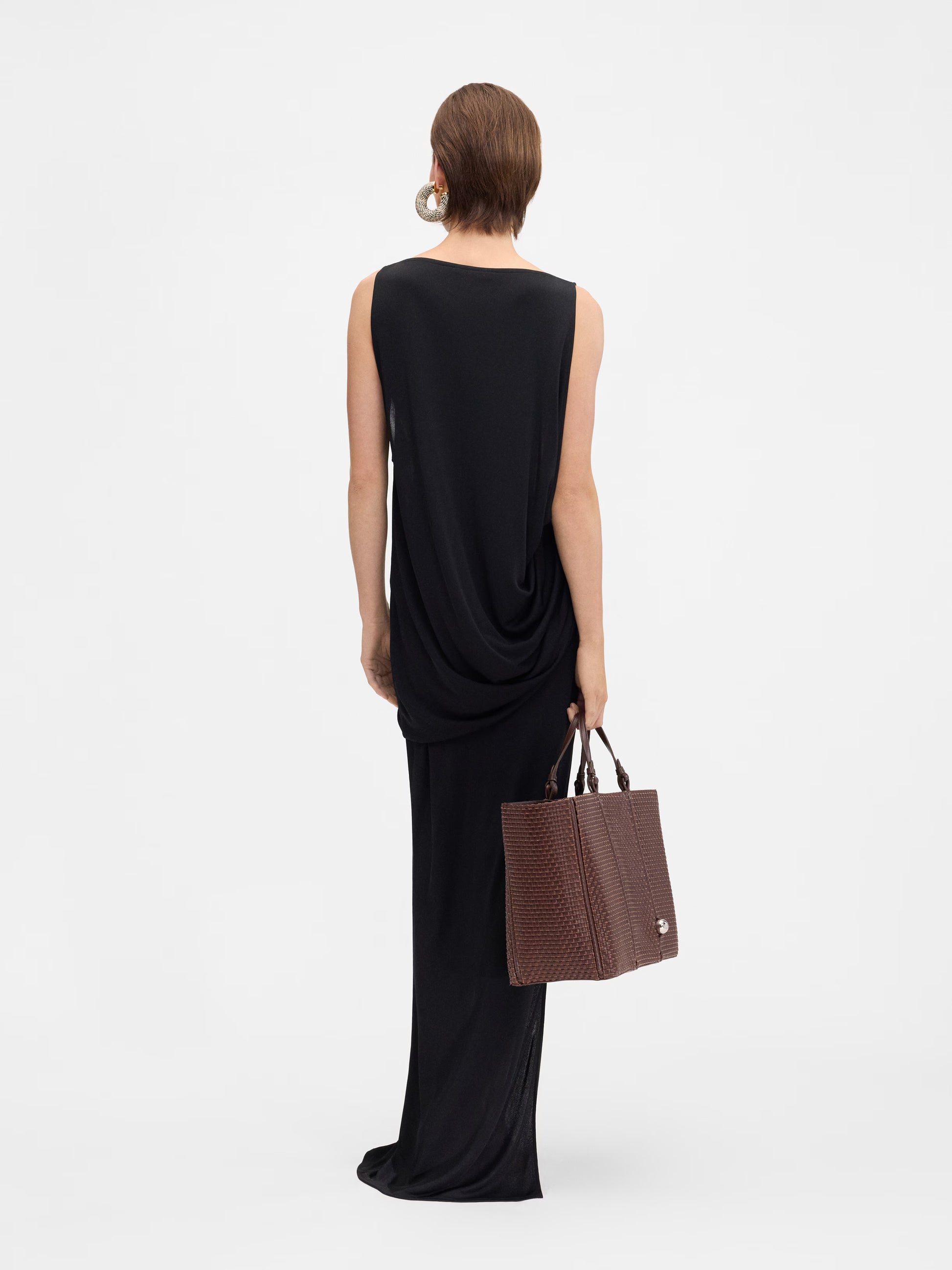 Black strapless gown on a white background