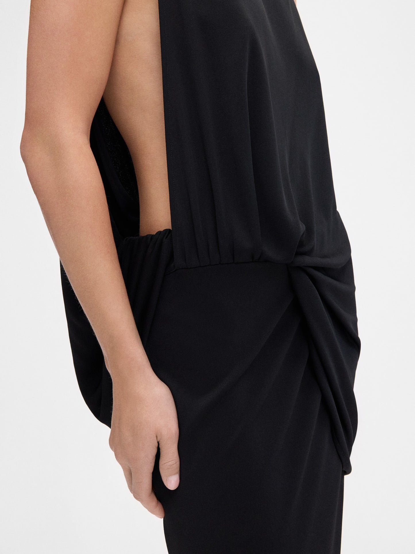 Black strapless gown on a white background