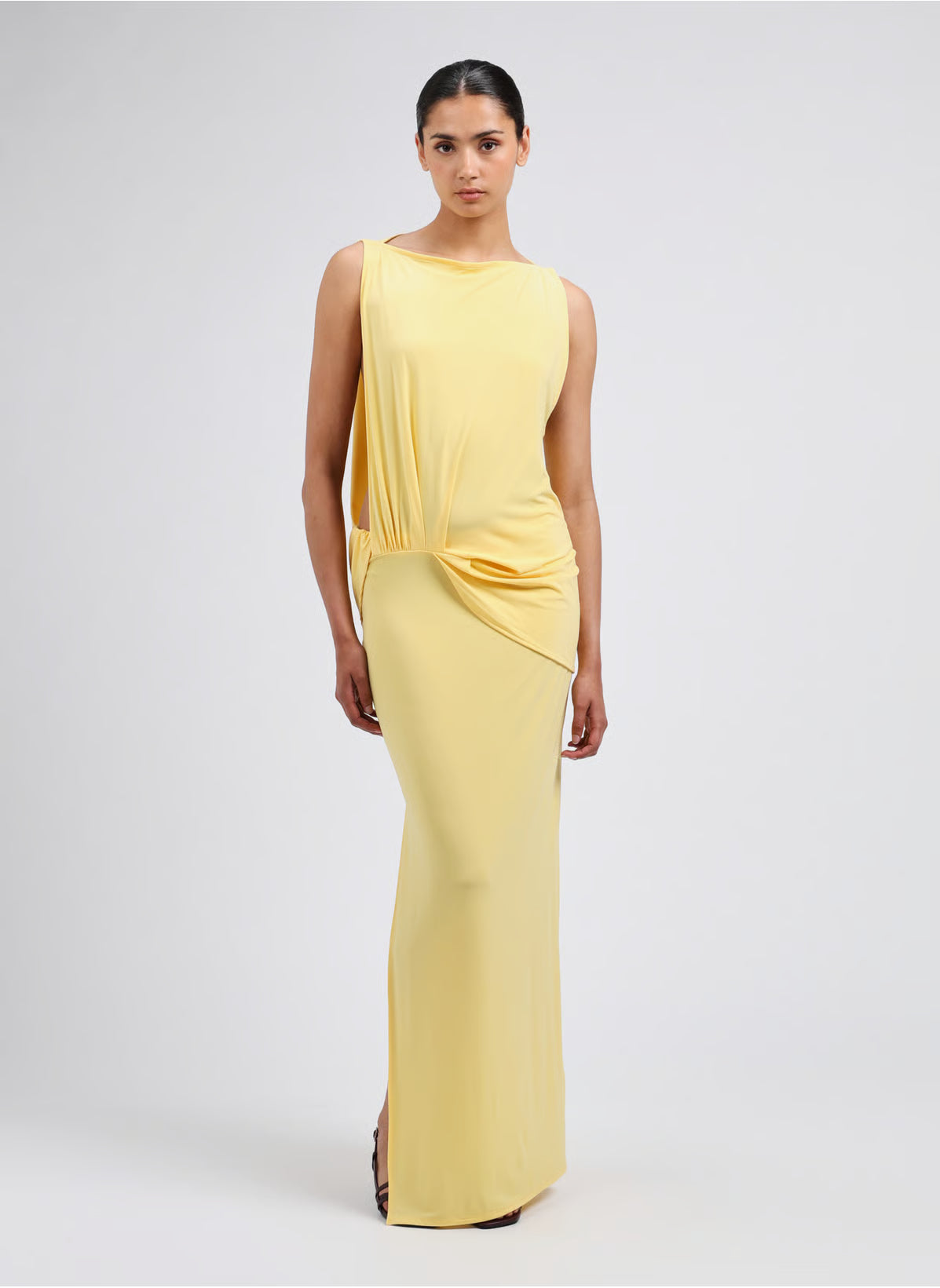 Yellow strapless dress on a light gray background